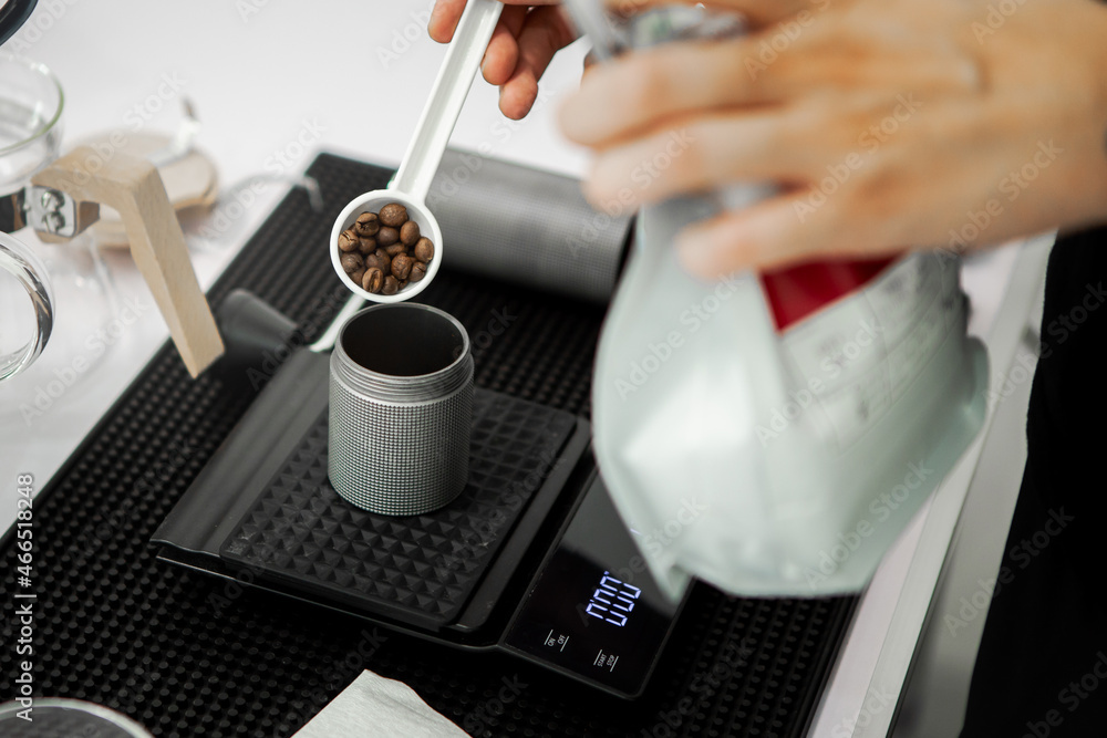 Put the coffee beans in the coffee grinder. For making coffee in the morning