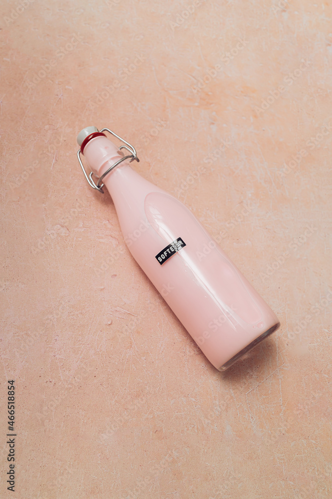 Single DIY pink detergent in a glass bottle with an embossed black label Multi Purpose on a pink background. Eco friendly zero waste household concept. Copy space. Top view. Single DIY pink detergent in a glass bottle with an embossed black label Multi Purpose on a pink background. Eco friendly zero waste household concept. Copy space. Top view.