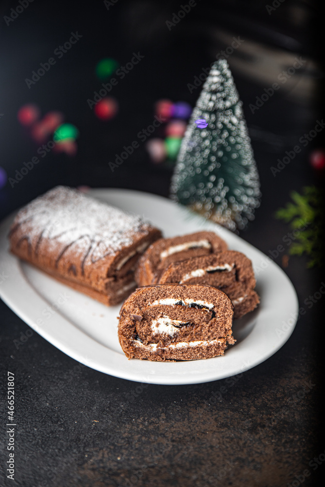 christmas cake roll chocolate white cream ready to eat meal snack on the table copy space food background rustic. top view christmas cake roll chocolate white cream ready to eat meal snack on the table copy space food background rustic. top view