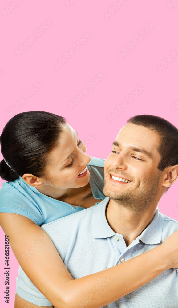 Smiling happy amazed couple. Portrait image of standing close models in love studio concept, isolated over rose pink color background. Young man and woman posing together. Copy space. Smiling happy amazed couple. Portrait image of standing close models in love studio concept, isolated over rose pink color background. Young man and woman posing together. Copy space.
