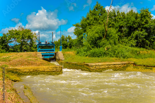 traditional rice field irrigation system in eastern Indonesia. water flows from small rivers and irrigates rice fields from village to village.