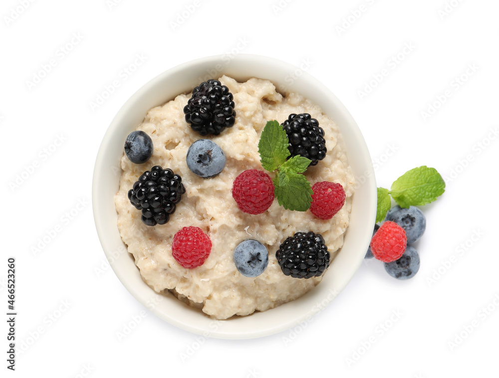 Tasty oatmeal porridge with blackberries, raspberries and blueberries in bowl on white background, top view Tasty oatmeal porridge with blackberries, raspberries and blueberries in bowl on white background, top view