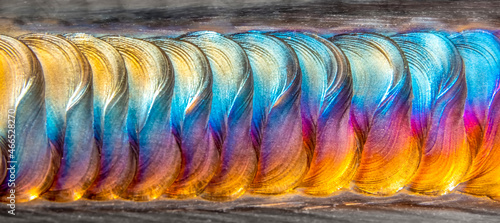 Welding of stainless steel with argon arc welding. Welding TIG. Color welding seam.