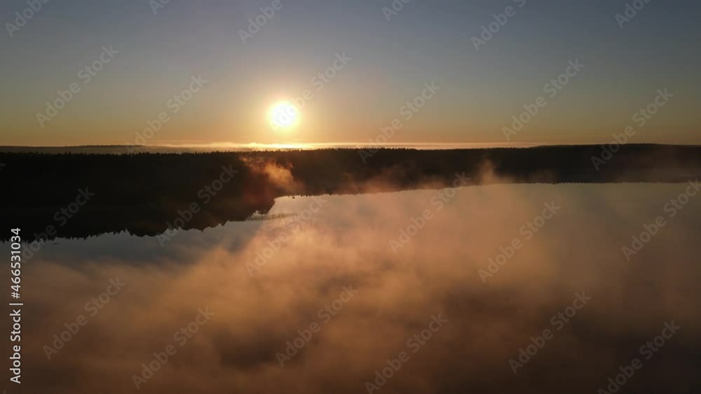 Flying Through Morning Fog over Lake with Distant Forest on the Shore Flying Through Morning Fog over Lake with Distant Forest on the Shore