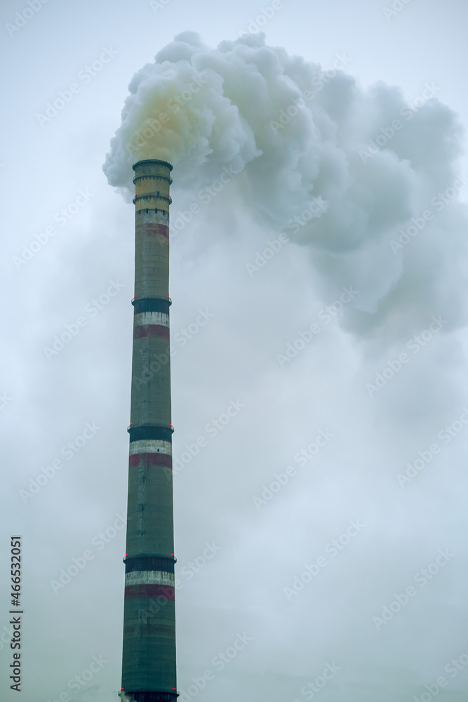 Environmental pollution by industrial waste. Emission of harmful substances into the atmosphere. Pipes of plant.