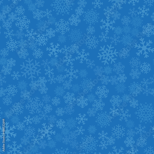 Seamless winter background of snowflakes placed chaotically. Winter fairy tale, Christmas symbol.