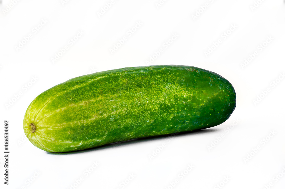 One cucumber for fresh vegetables, isolated on a white background One cucumber for fresh vegetables, isolated on a white background