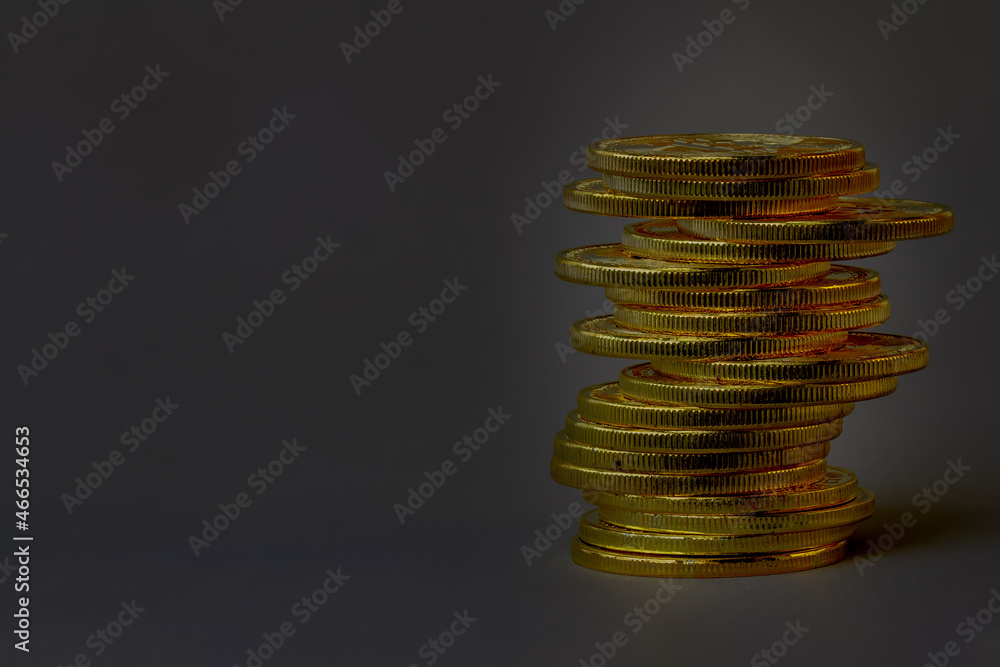 A pile of Bitcoins that have a gold color that is currently popular and has an increasing value compared to the US Dollar. For payment, finance, investment and economy concepts A pile of Bitcoins that have a gold color that is currently popular and has an increasing value compared to the US Dollar. For payment, finance, investment and economy concepts