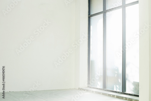 Construction - a spacious room with large windows.