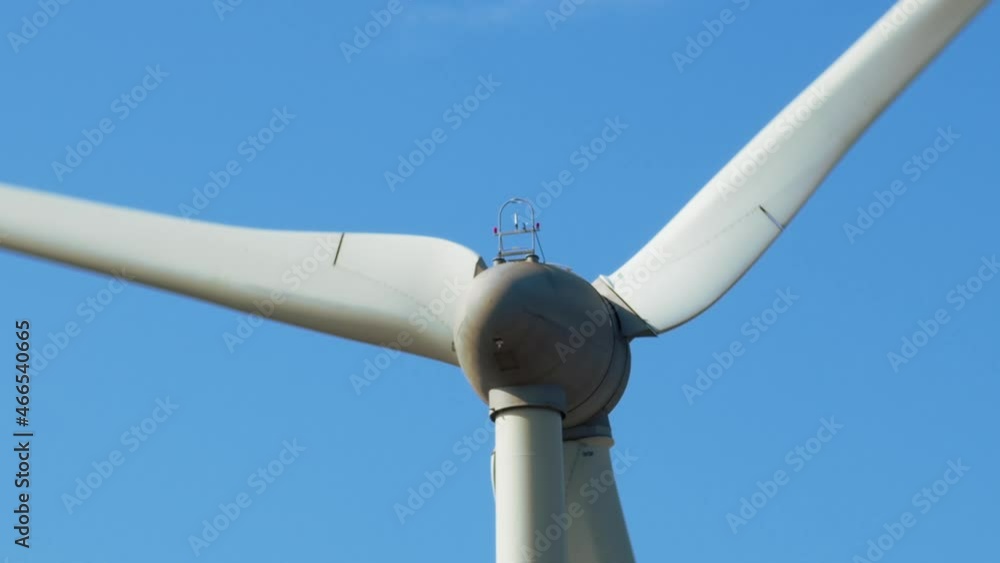 Close up of wind turbine with moving blades. Alternative, clean, and renewable energy sources. Closeup on turbine. Close up of wind turbine with moving blades. Alternative, clean, and renewable energy sources. Closeup on turbine.