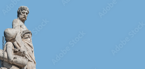 Quadro em tela Banner with sculpture of old engineer and his scholar on Custom Bridge in Magdeburg downtown, Germany, at blue sky solid background with copy space