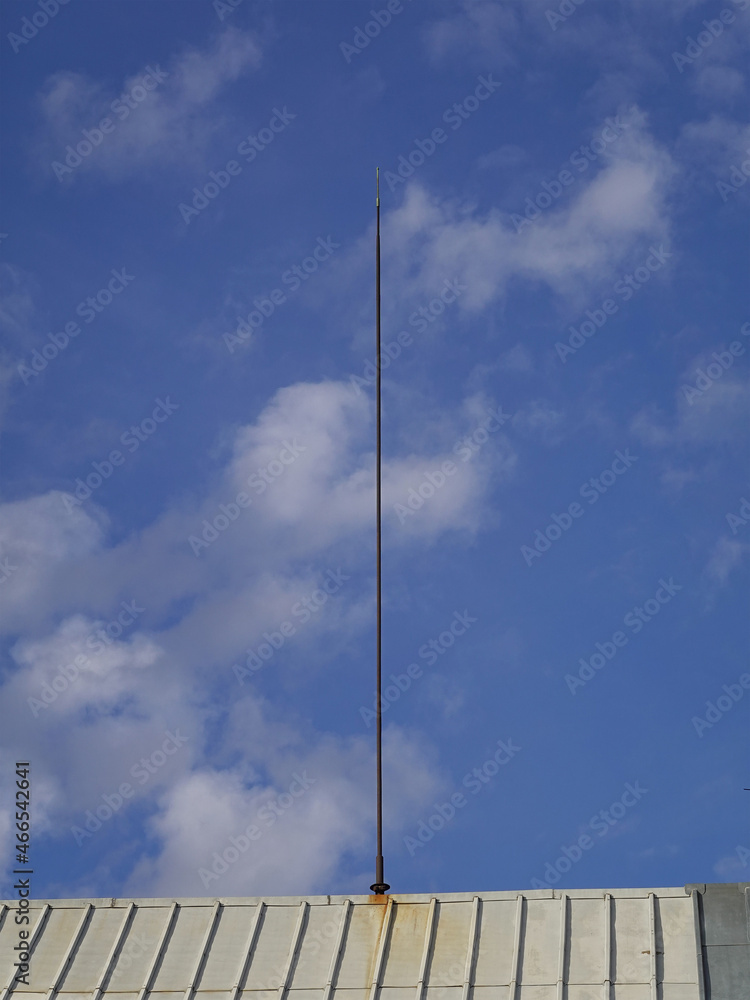 A lightning rod on a high roof. A lightning rod on a high roof.