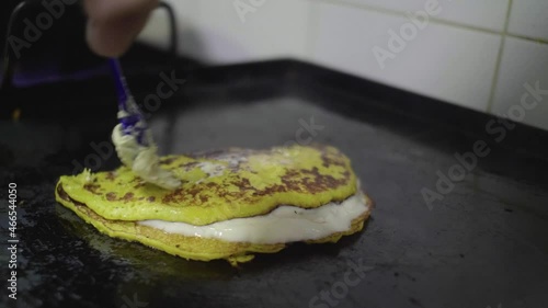 Preparation of a Traditional Venezuelan Dish, Sweet Corn Crepe Cachapa Filled with Cheese