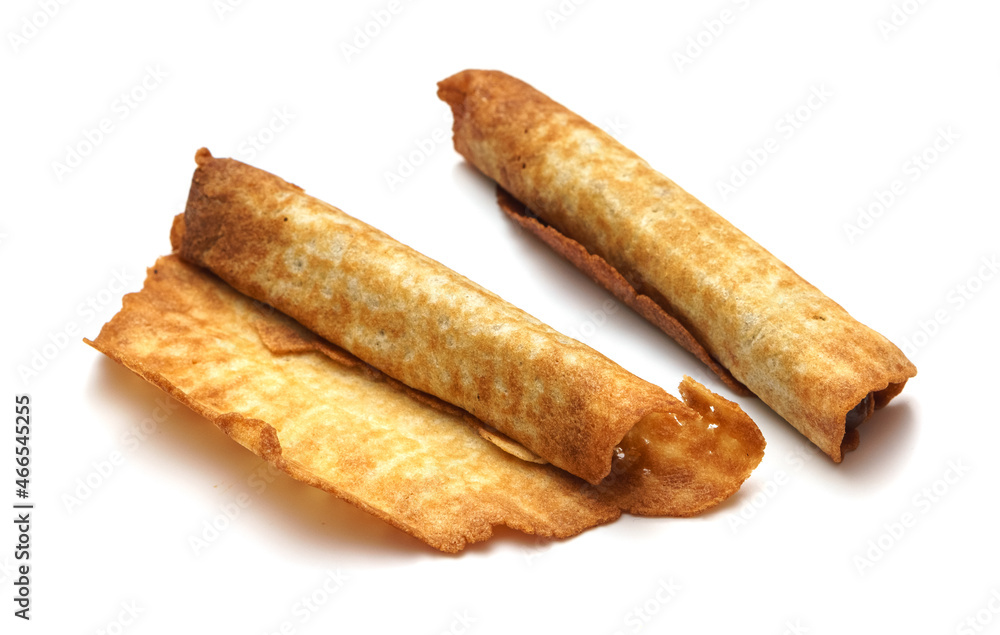Homemade waffle cone with condensed milk isolated on a white background. Sweetness. Breakfast. Condensed milk. Dessert. Homemade waffle cone with condensed milk isolated on a white background. Sweetness. Breakfast. Condensed milk. Dessert.