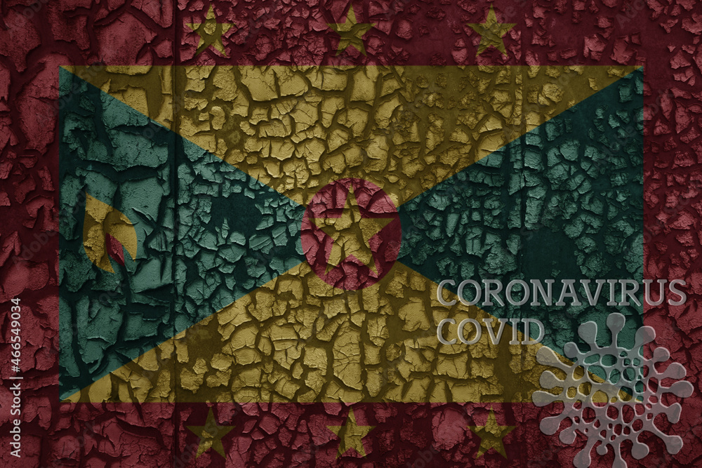 flag of grenada on a old metal rusty cracked wall with text coronavirus, covid, and virus picture. flag of grenada on a old metal rusty cracked wall with text coronavirus, covid, and virus picture.
