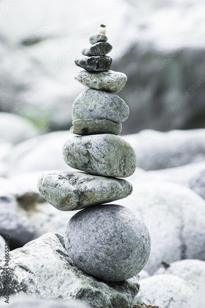 Balanced stones forming a natural sculpture in a river or waterfall Balanced stones forming a natural sculpture in a river or waterfall