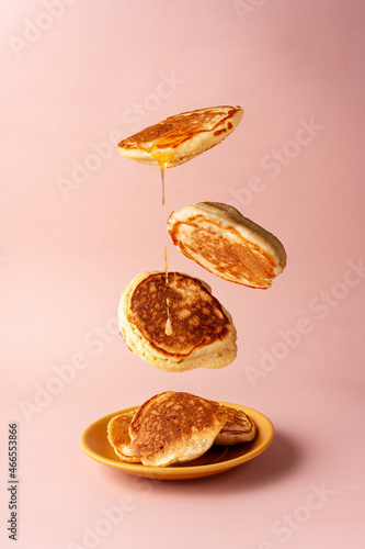 Photos mini pancakes with jam flying food selective focus