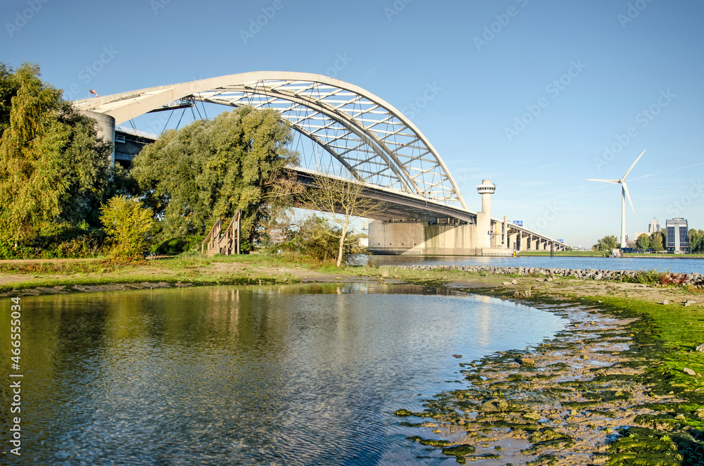 Obraz premium Rotterdam, The Netherlands, October 28, 2021: view of Van Brienenoord bridge as seen from the island with the smae name