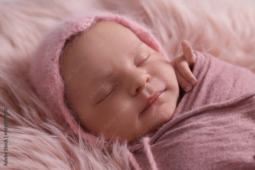 Adorable newborn baby lying on faux fur, closeup Adorable newborn baby lying on faux fur, closeup