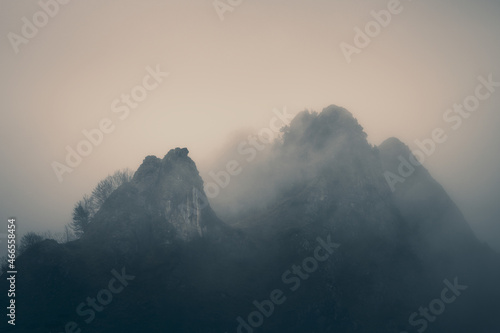 Mysterious black mountain in the fog 