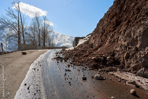 Early spring in the mountains. The rocks fell on the road. Dangerous bugle road. Rockfall in the mountains