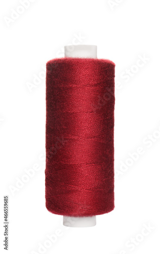 Spool of burgundy sewing thread isolated on white