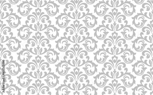 Wallpaper in the style of Baroque. Seamless vector background. White and gray floral ornament. Graphic pattern for fabric, wallpaper, packaging. Ornate Damask flower ornament.
