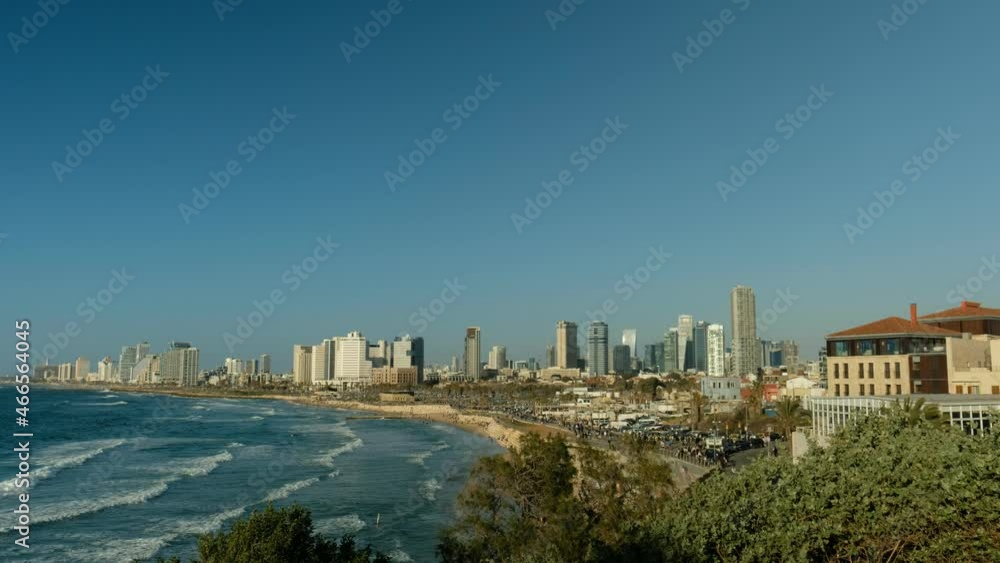An afternoon beachfront view of a city with hotels, commercial buildings and stretched Mediterranean beaches. a 4K, 24P video clip, Tel Aviv, Israel. An afternoon beachfront view of a city with hotels, commercial buildings and stretched Mediterranean beaches. a 4K, 24P video clip, Tel Aviv, Israel.
