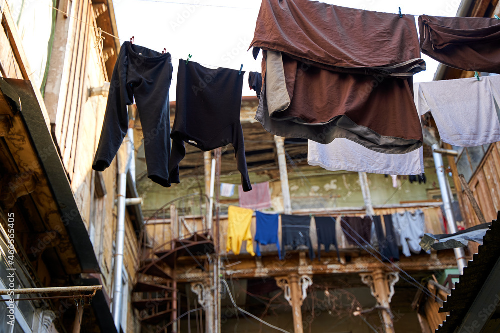 Household traditions in Georgia. The washed laundry is dried on the balcony outside Household traditions in Georgia. The washed laundry is dried on the balcony outside
