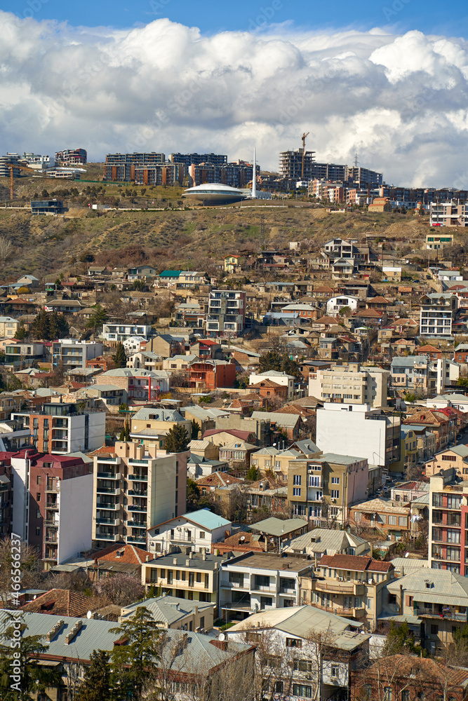 Panorama of a densely populated city. Tbilisi city landscape from above
