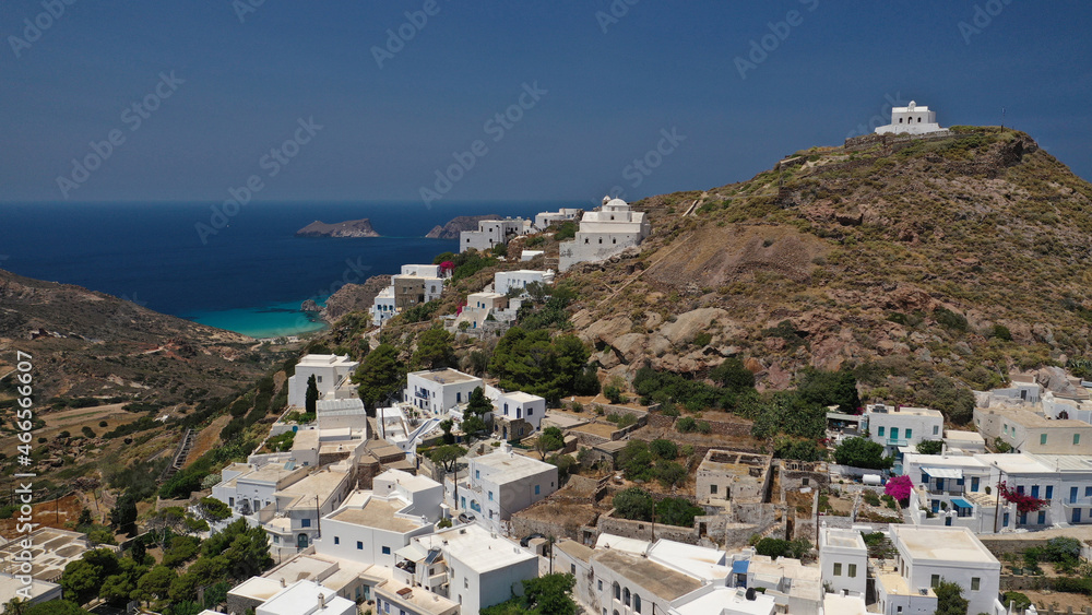 Aerial drone photo of main village of Plaka, main village of Milos island featuring uphill castle and scenic views to Aegean sea, Cyclades, Greece