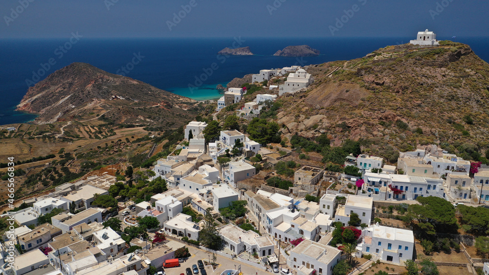 Aerial drone photo of main village of Plaka, main village of Milos island featuring uphill castle and scenic views to Aegean sea, Cyclades, Greece Aerial drone photo of main village of Plaka, main village of Milos island featuring uphill castle and scenic views to Aegean sea, Cyclades, Greece