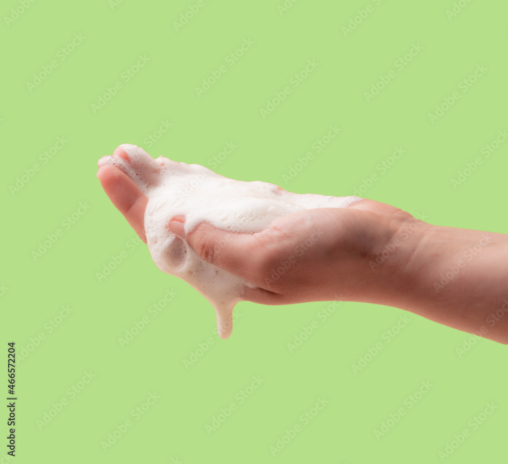 Fototapeta premium Foam on the hand. Cleaning agent or natural soap