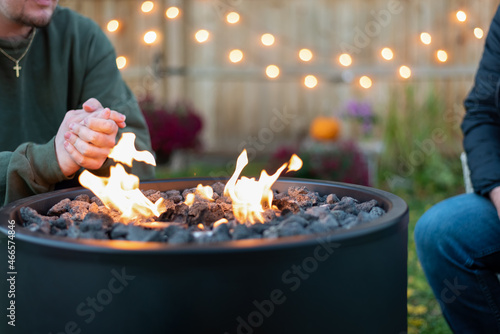 People around a backyard fire pit