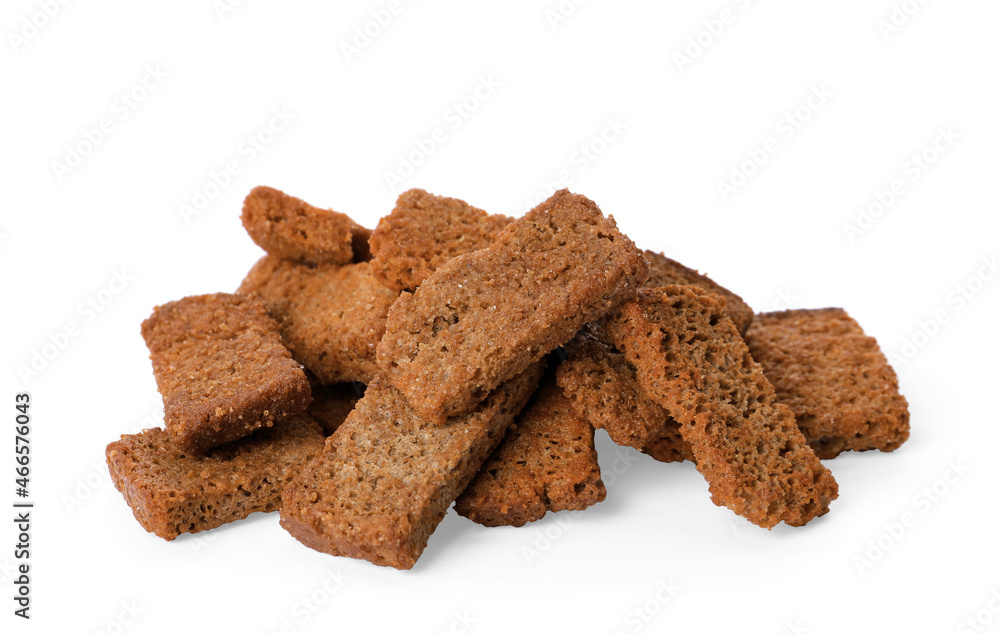 Heap of crispy rusks with seasoning on white background Heap of crispy rusks with seasoning on white background