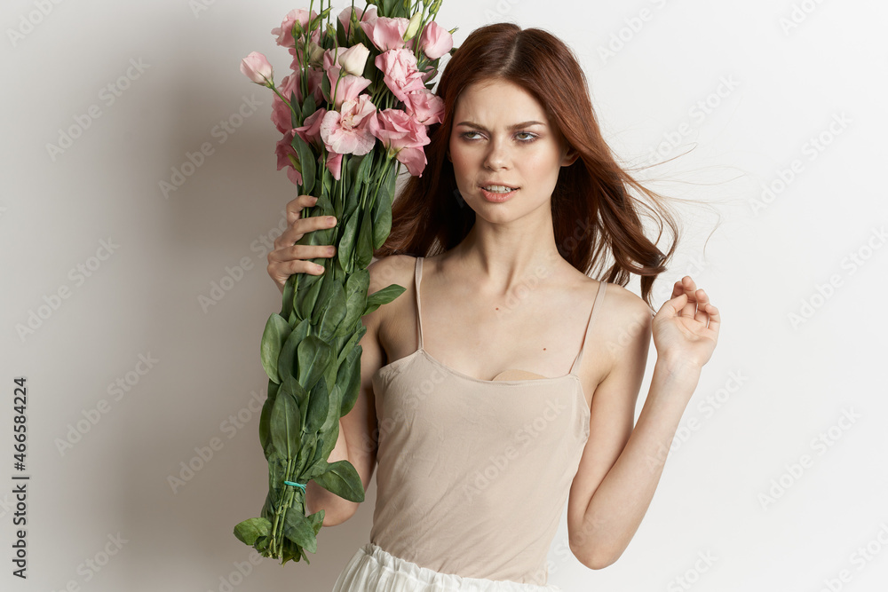 attractive woman with a bouquet of flowers isolated background attractive woman with a bouquet of flowers isolated background