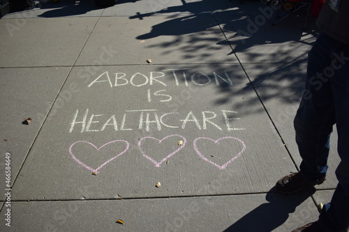 Washington, DC, USA - November 1, 2021: Abortion is Healthcare Written in Chalk on the Sidewalk in front of the U.S. Supreme Court to Protest the Texas Abortion Law While the Court Hears Arguments photo