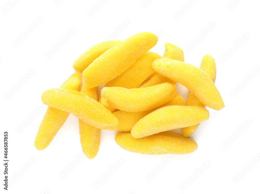 Pile with jelly candies in shape of banana on white background, top view Pile with jelly candies in shape of banana on white background, top view