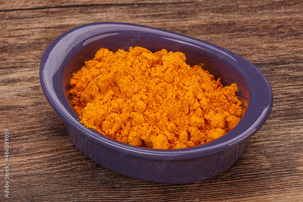Tumeric powder in the bowl Tumeric powder in the bowl