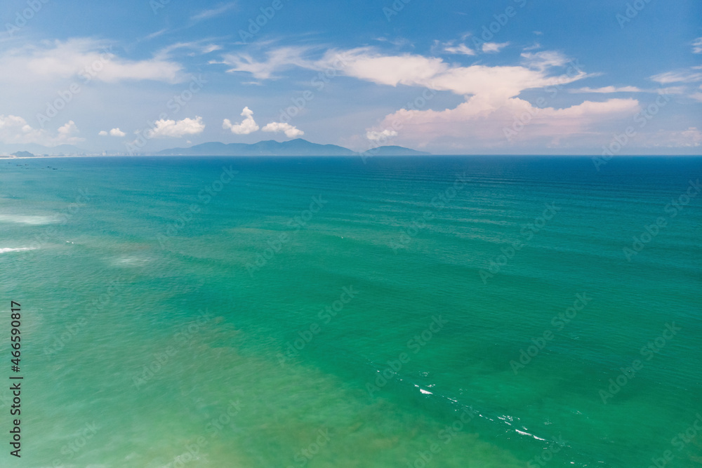 Aerial view of beautiful vietnamese landscape, emerald South China Sea near Hoi An and blue cloudy sky, Vietnam Aerial view of beautiful vietnamese landscape, emerald South China Sea near Hoi An and blue cloudy sky, Vietnam