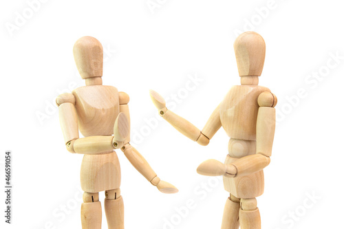 two wooden figures of people communicate photo