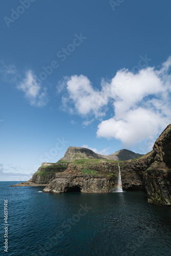 Mulafossur waterfall that drops into the ocean in Gasadalur on Faroe Islands