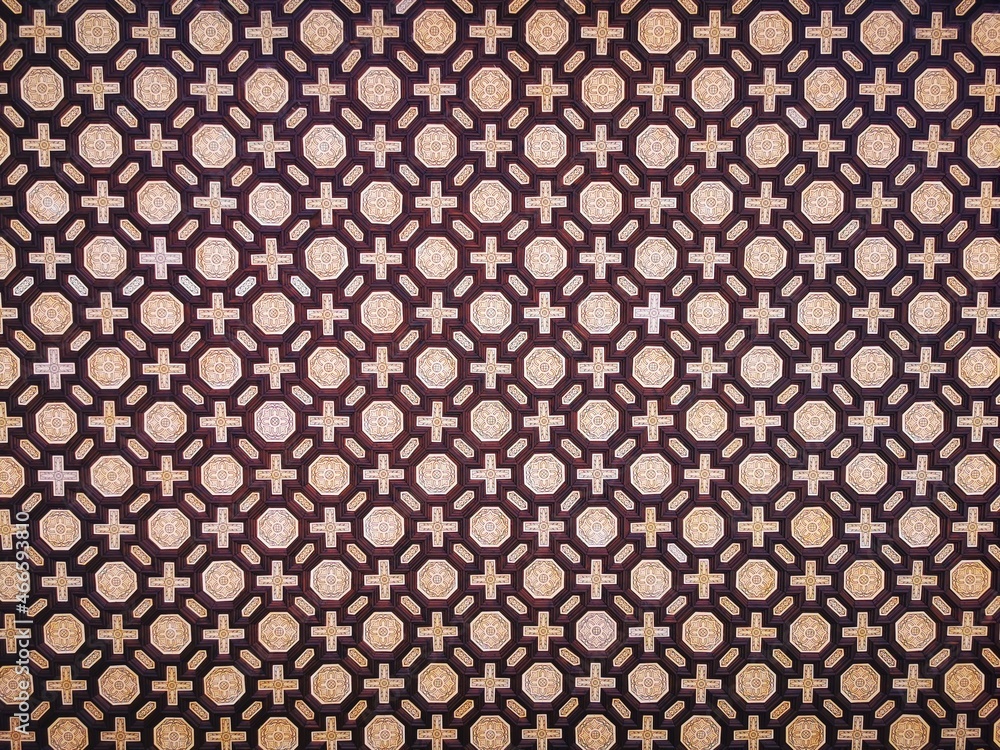 Tile with decorative geometric pattern on ceiling and wall. Real Alcázar de Sevilla