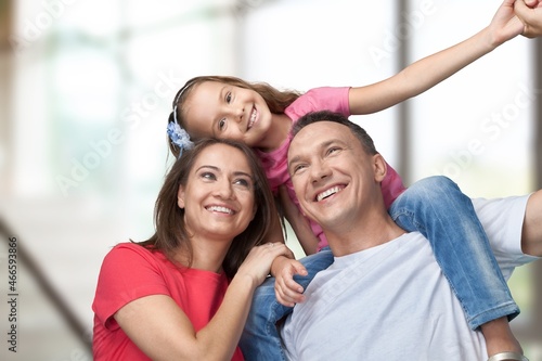 Cheerful happy young Family having Fun Together At Home