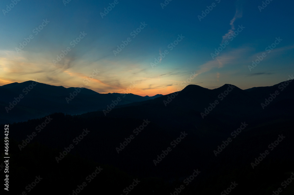 Silhouette of mountain landscape at sunset. Drone photography