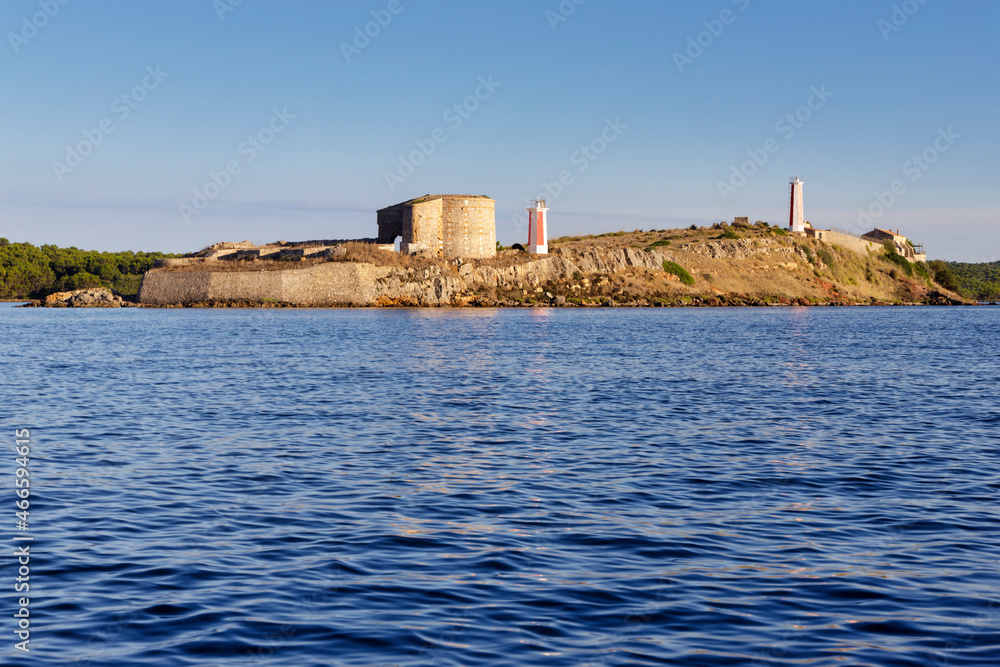 island, tower and lighthouse of Ses Sargantanes, fornells,  menorca, balearic islands, spain
