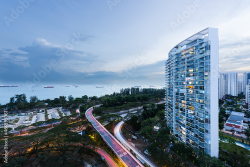 Photography Condominium building overlooking a highway and the Singapore strait