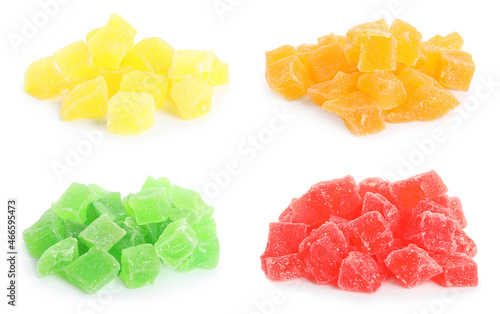 Set with tasty pieces of candied fruits on white background