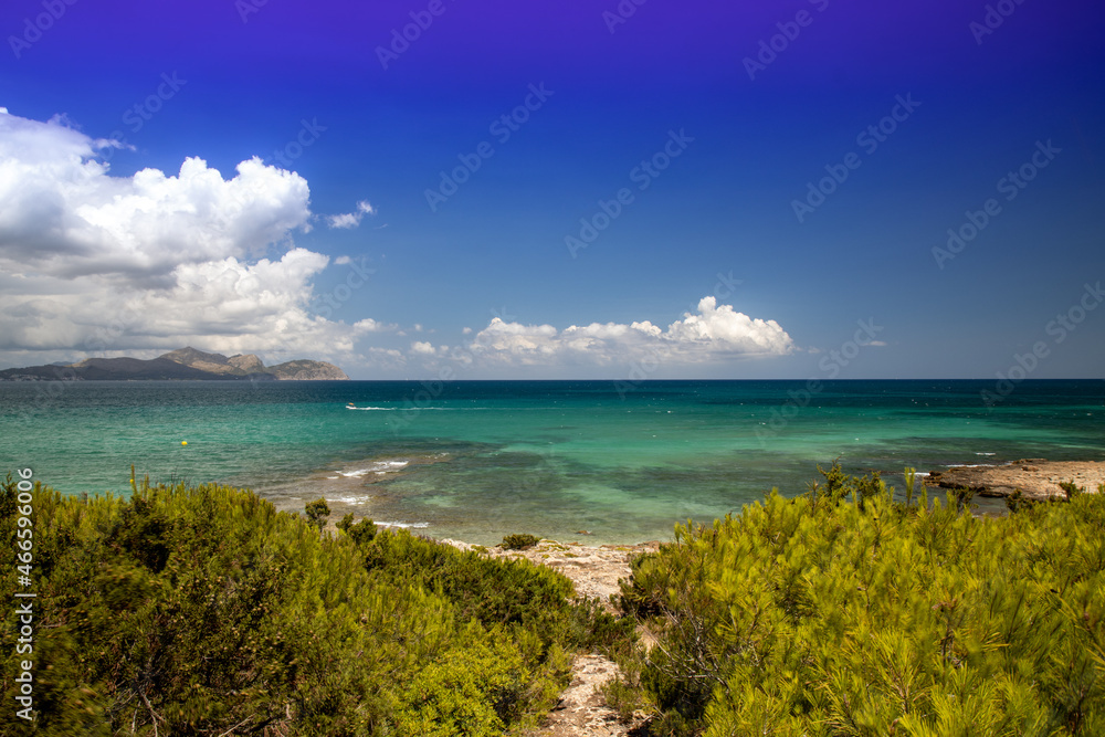 The beautiful beach front on the Island of Majorca in Spain, showing the beautiful beach front on a sunny summers day
