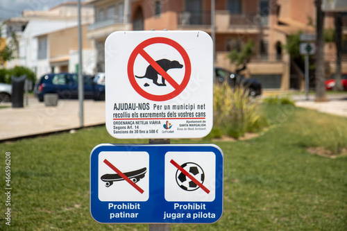 Majorca, Spain, 27th July 2021: A sign to warn about dogs fouling on the grass and to indicate no skateboarding or football games taken on the beautiful island of Majorca in Spain